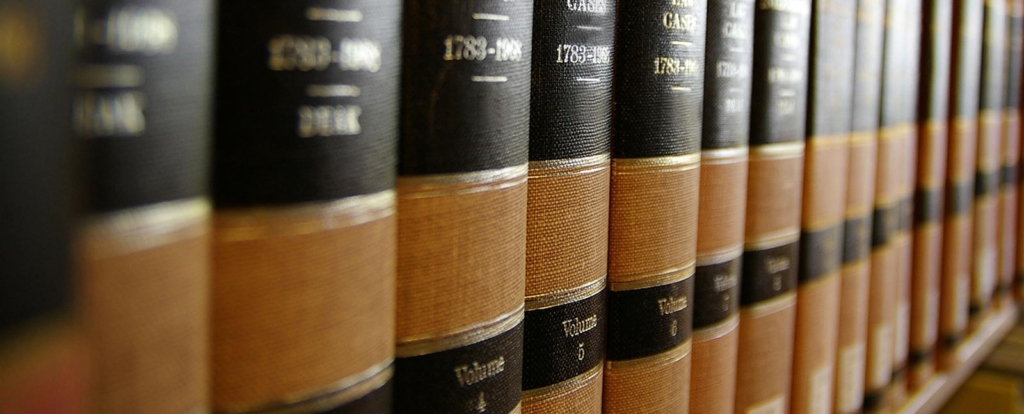 A picture of the law books in the wooden shelf